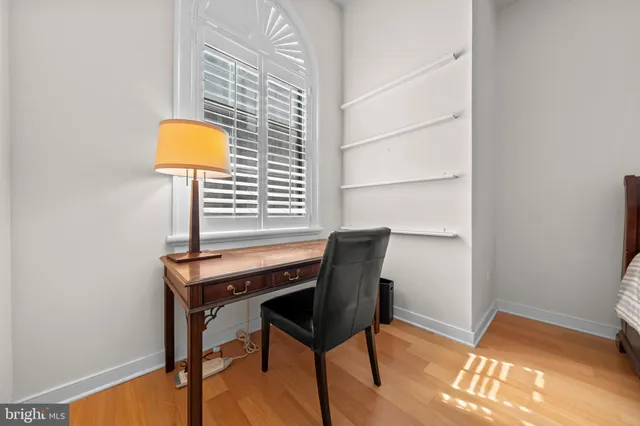 a view of a hallway with chandelier and entryway