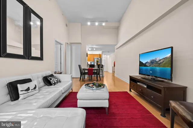 a kitchen with stainless steel appliances granite countertop a refrigerator stove top oven and sink