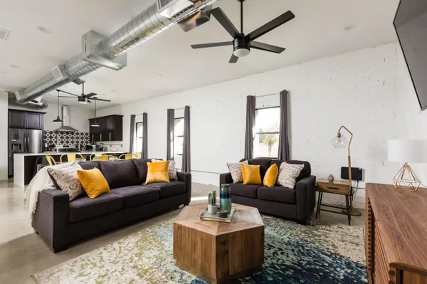 a living room with furniture and a large window