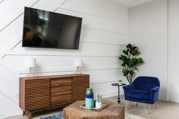 a living room with furniture and a flat screen tv