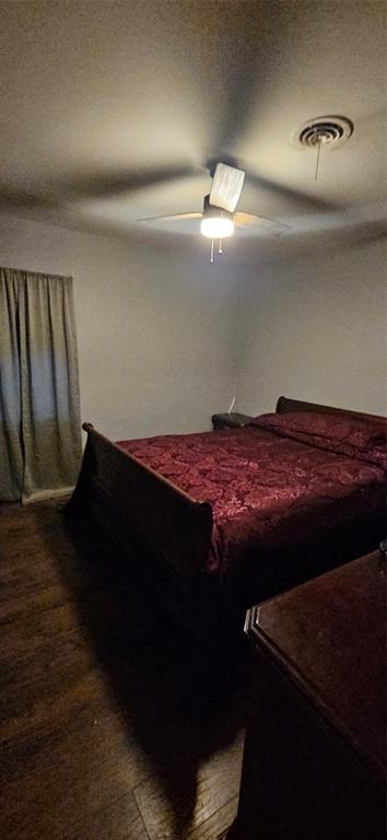 6766 Broadacres Road Shreveport, LA 71129 - Photo 12 of 20 a bed sitting in a bedroom next to a lamp