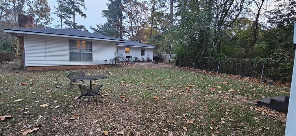 6766 Broadacres Road Shreveport, LA 71129 - Photo 20 of 20 a view of a house with backyard and a tree