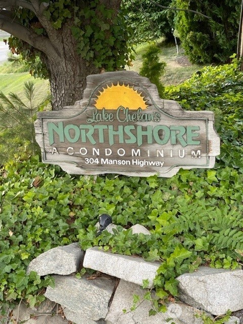 304 Highway 150, Unit 1A Chelan, WA 98816 - Photo 2 of 25 a sign that is sitting on a brick wall
