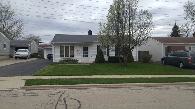 a view of a car park front of house