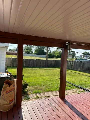 a view of a patio with wooden floor