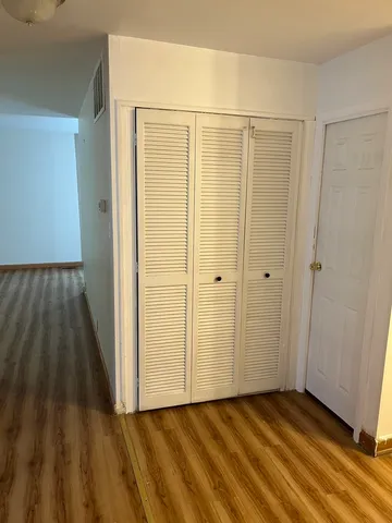 a view of a bathroom with wooden floor