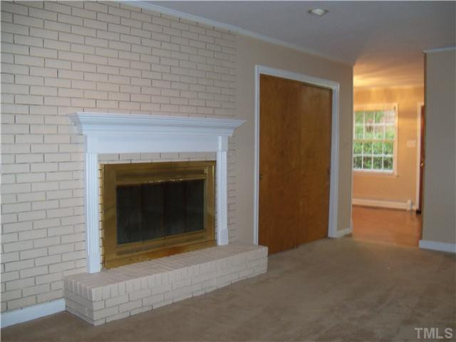 1700 Dixie Trail Raleigh, NC 27607 - Photo 7 of 12 Fireplace in the family room has gas logs. Den/Family/Great Room