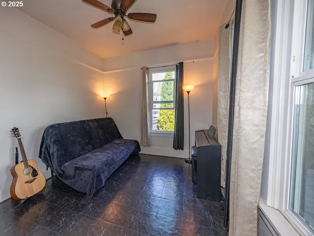 a living room with furniture and a window