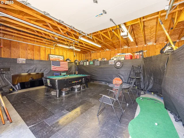 a backyard of a house with table and chairs