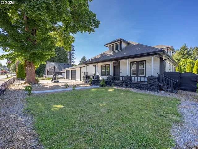a front view of a house with garden