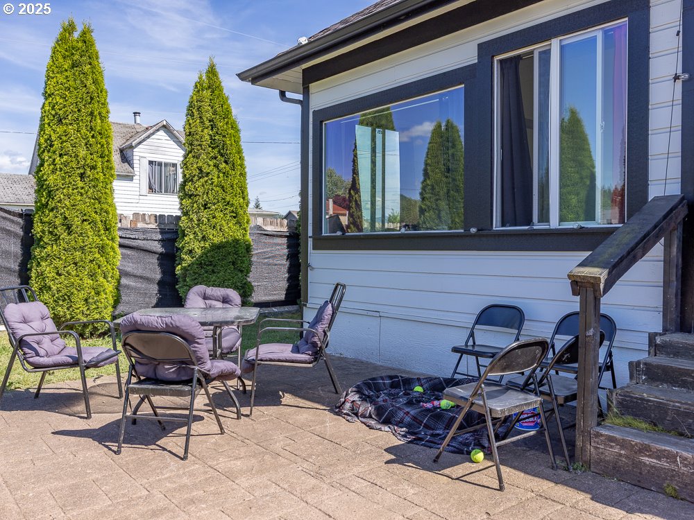 410 East Yacolt Road Yacolt, WA 98675 - Photo 29 of 39 a view of a chairs and table in a back yard