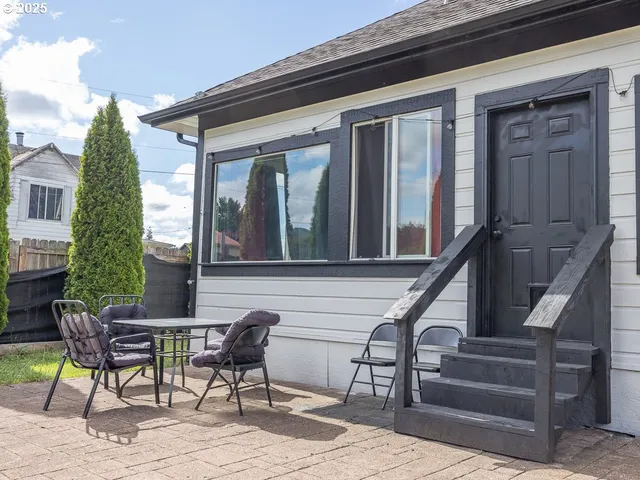 a view of two chairs in the balcony