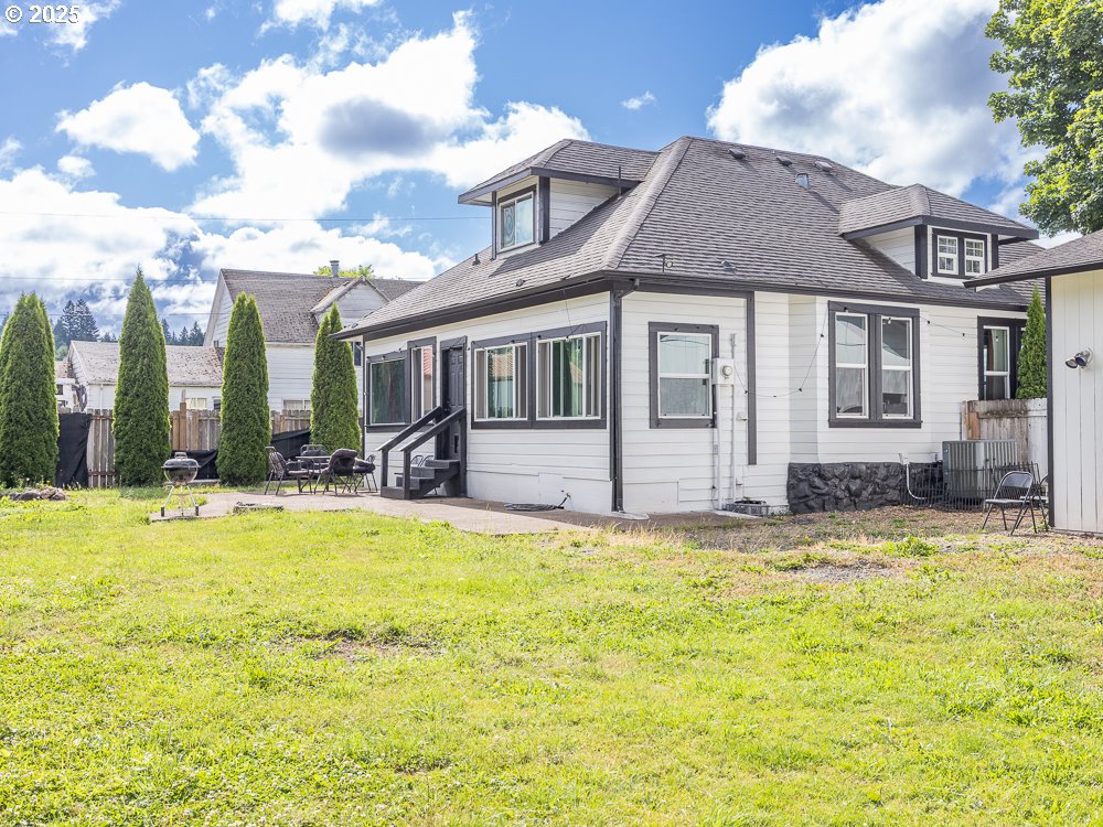 410 East Yacolt Road Yacolt, WA 98675 - Photo 37 of 39 a view of a house with swimming pool and a yard
