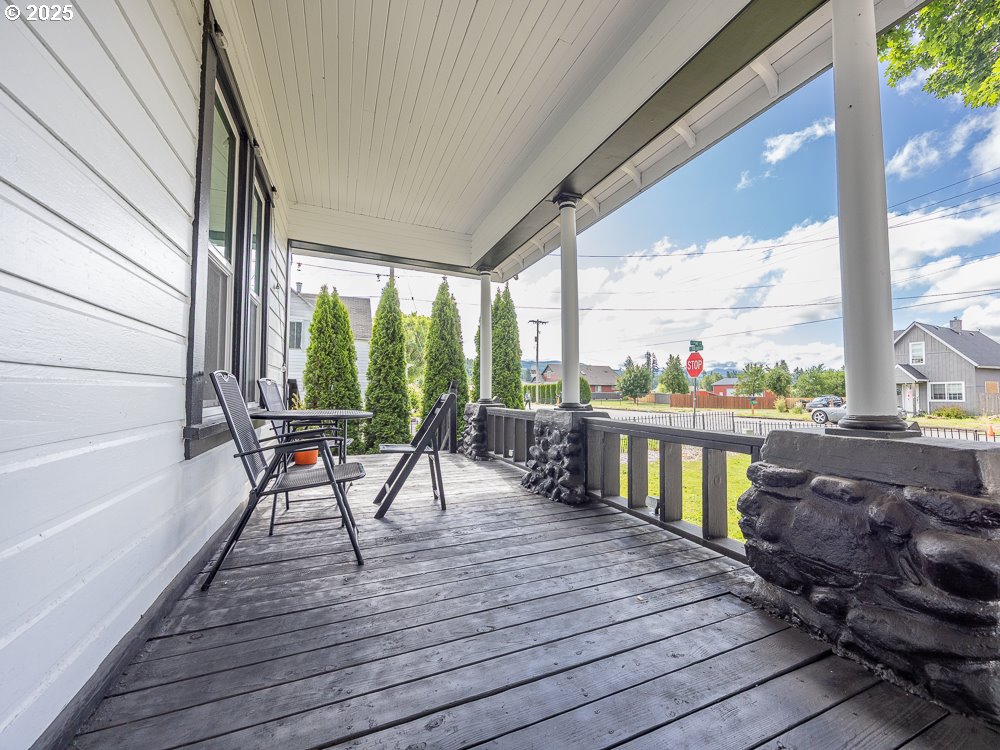 410 East Yacolt Road Yacolt, WA 98675 - Photo 38 of 39 a view of a balcony with chairs and wooden floor