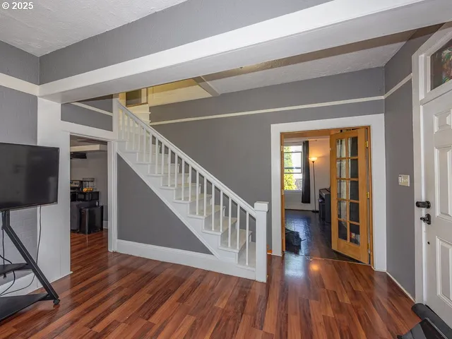 a view of entryway with wooden floor