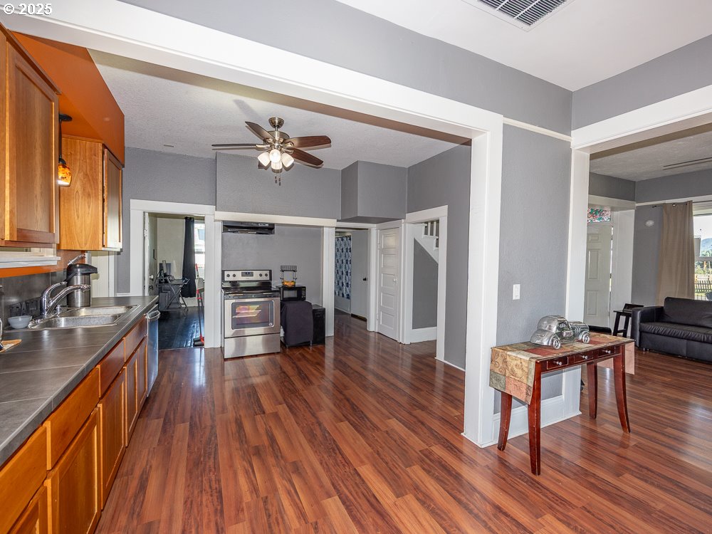 410 East Yacolt Road Yacolt, WA 98675 - Photo 6 of 39 a view of a kitchen and dining room with wooden floor