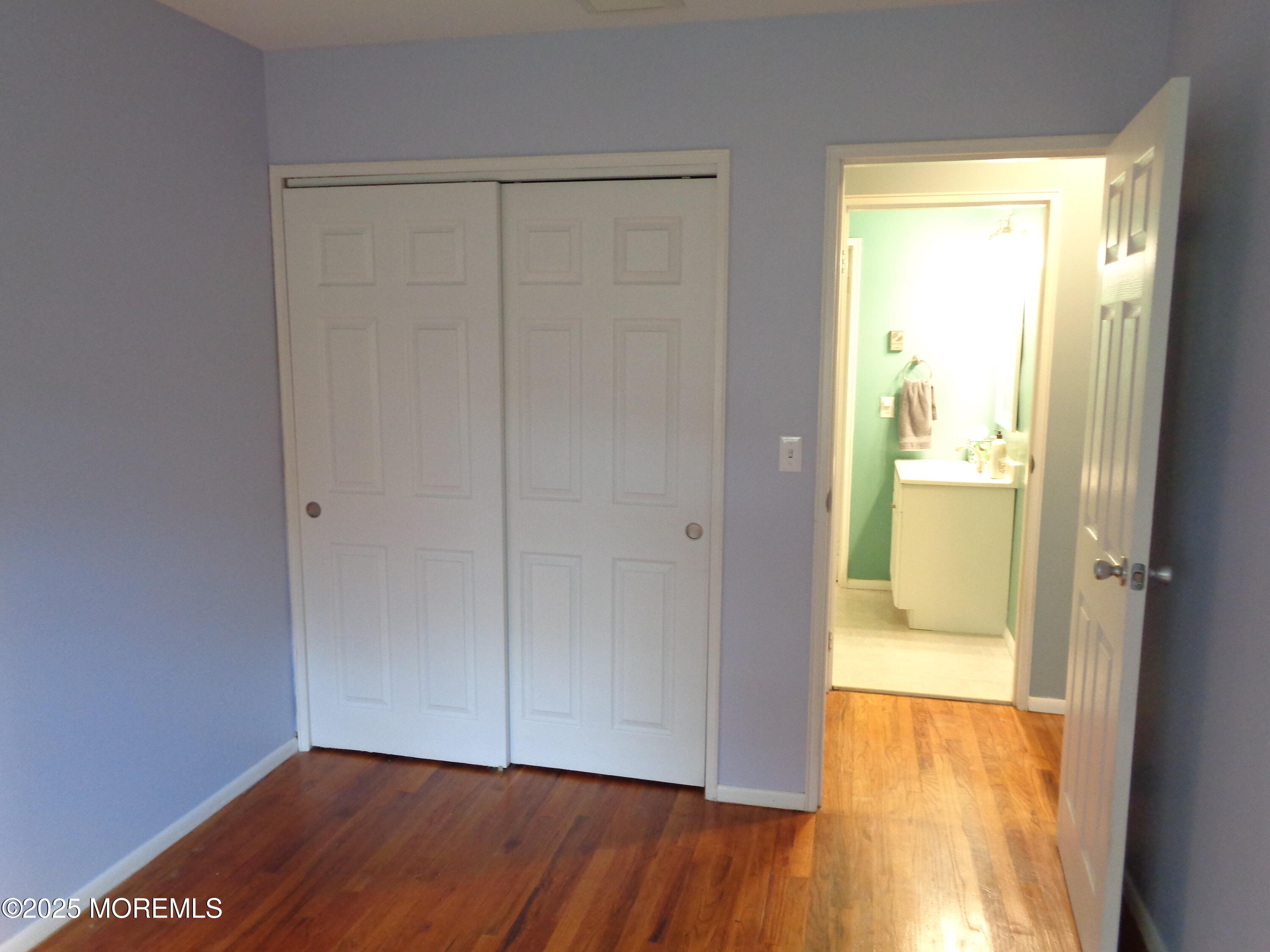 136 A Azalea Drive Whiting, NJ 08759 - Photo 13 of 21 a view of an empty room with wooden floor and a window