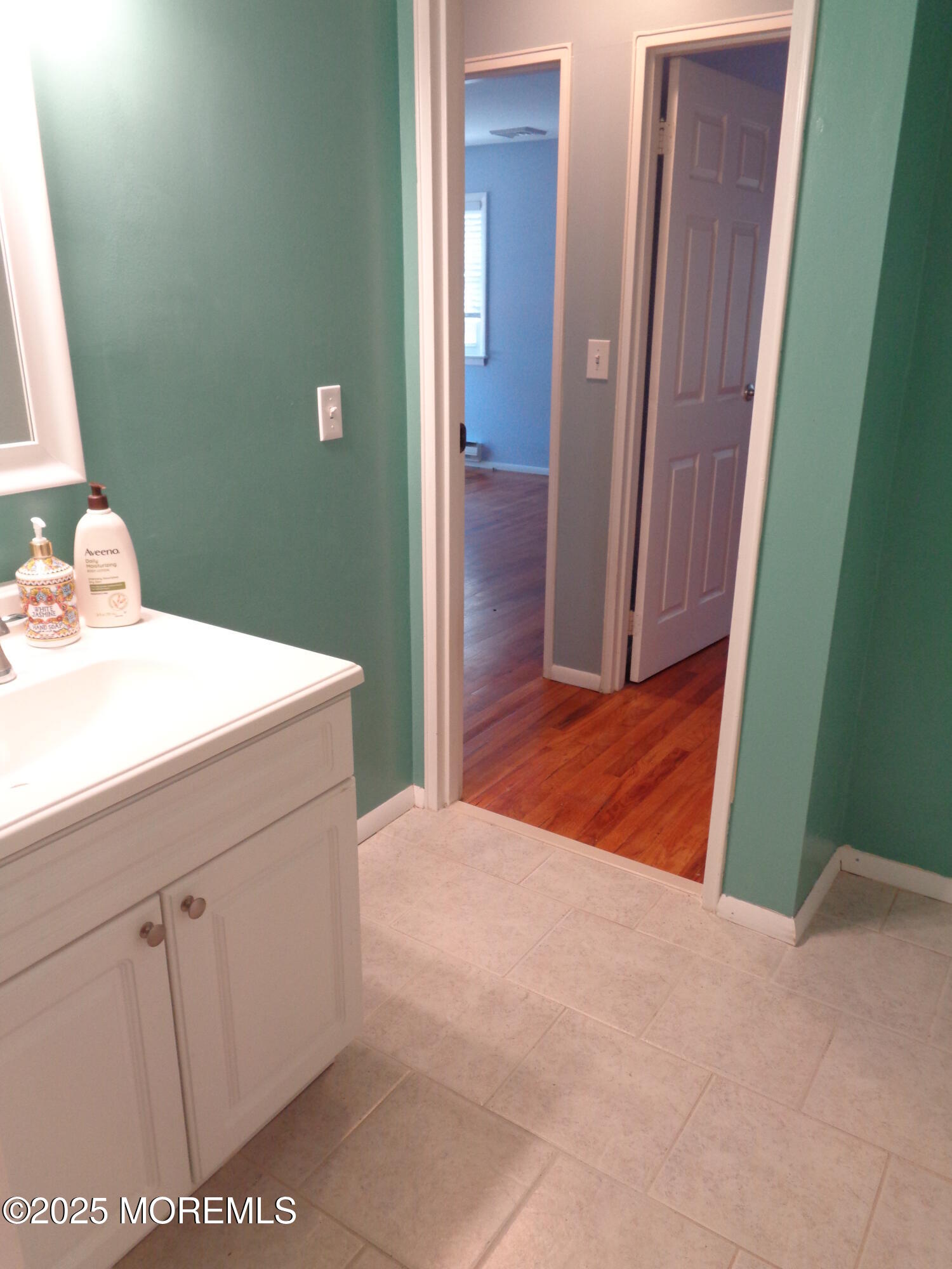 136 A Azalea Drive Whiting, NJ 08759 - Photo 17 of 21 a room with a sink and a mirror