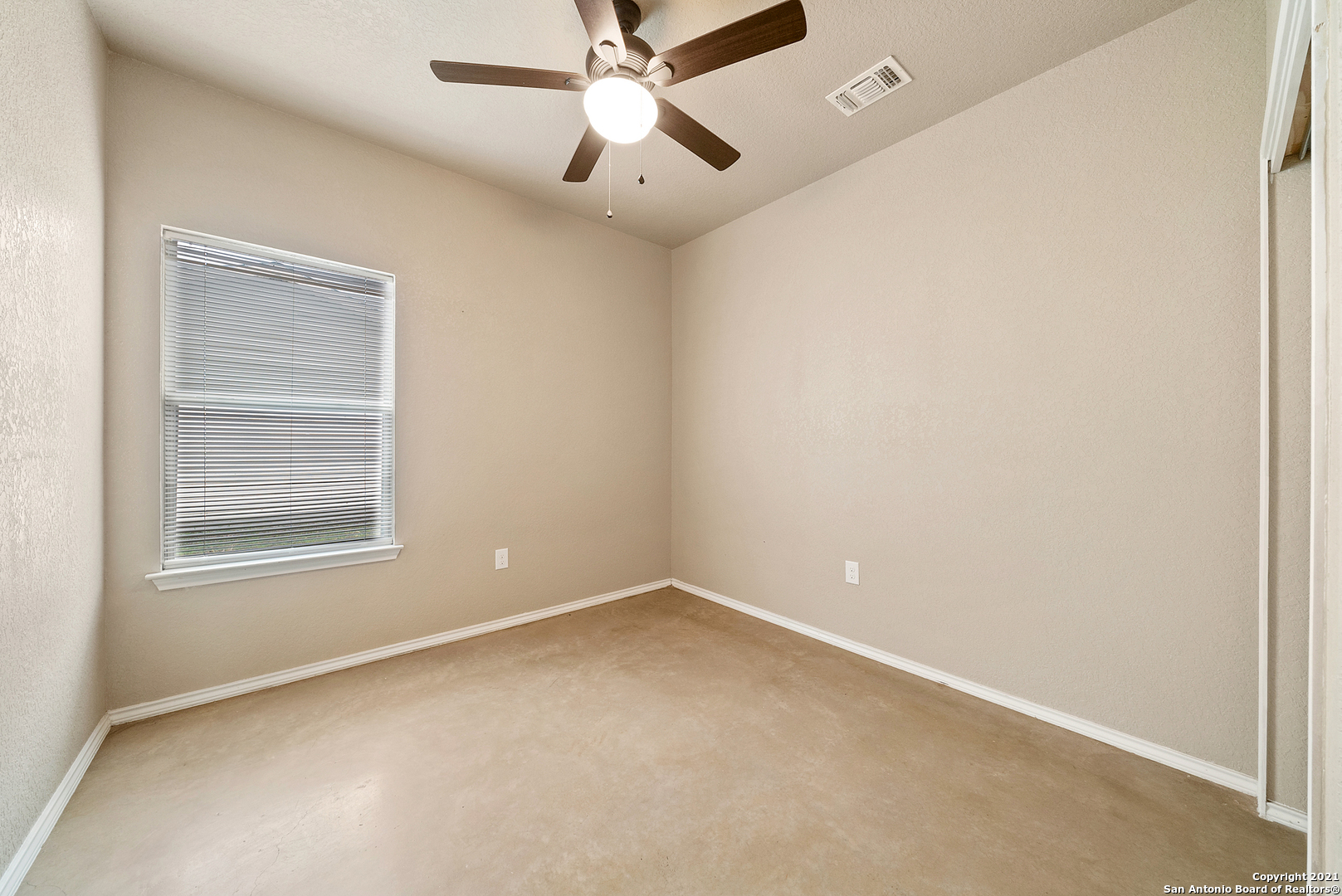 1534 Lahn Road New Braunfels, TX 78130 - Photo 17 of 25 an empty room with a window and a fan
