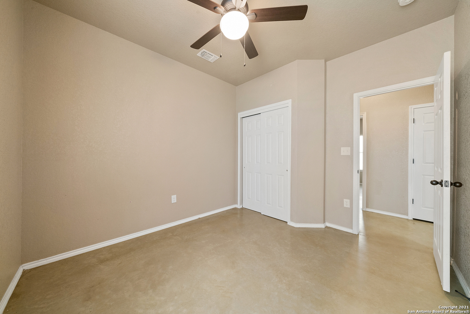 1534 Lahn Road New Braunfels, TX 78130 - Photo 18 of 25 an empty room with chandelier fan and closet area