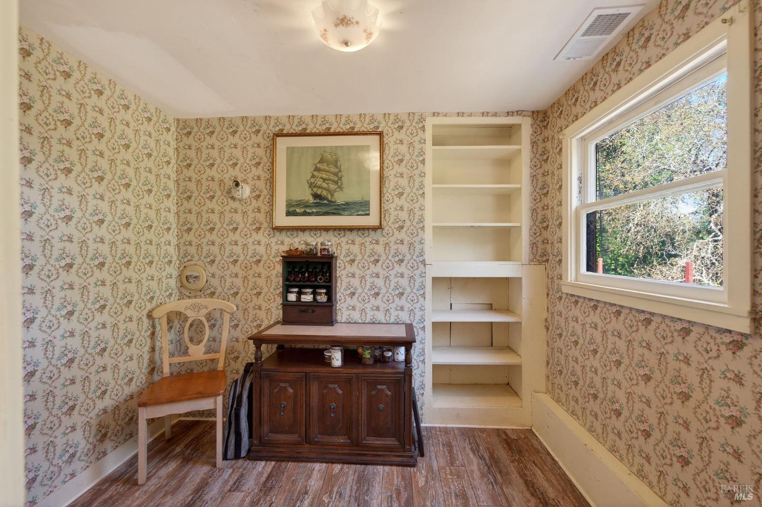 1450 Timberhill Road Santa Rosa, CA 95401 - Photo 13 of 50 a living room with a wooden floor and a fireplace
