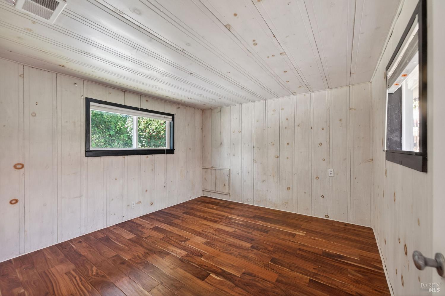 1450 Timberhill Road Santa Rosa, CA 95401 - Photo 29 of 50 a view of a room with wooden floor and window
