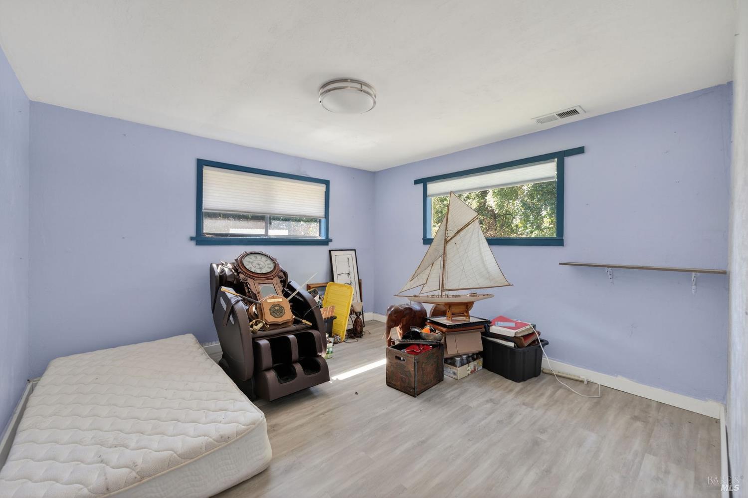 1450 Timberhill Road Santa Rosa, CA 95401 - Photo 31 of 50 a bed room with furniture and a flat screen tv