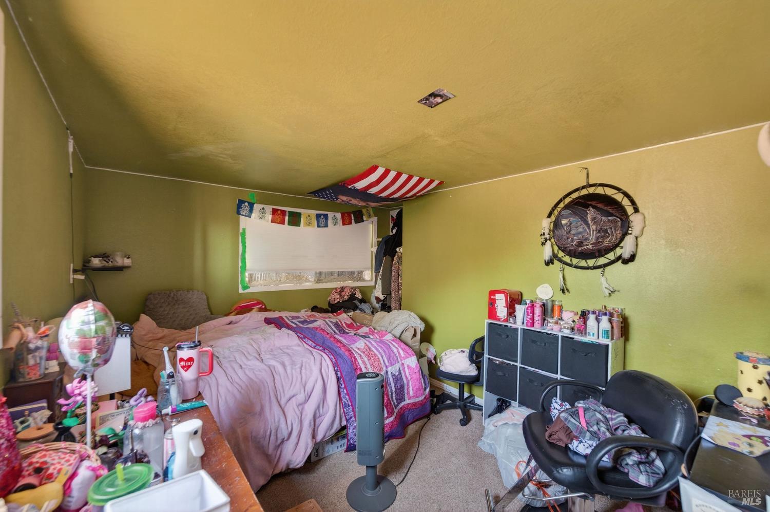 1450 Timberhill Road Santa Rosa, CA 95401 - Photo 36 of 50 a bedroom with bed and a chandelier