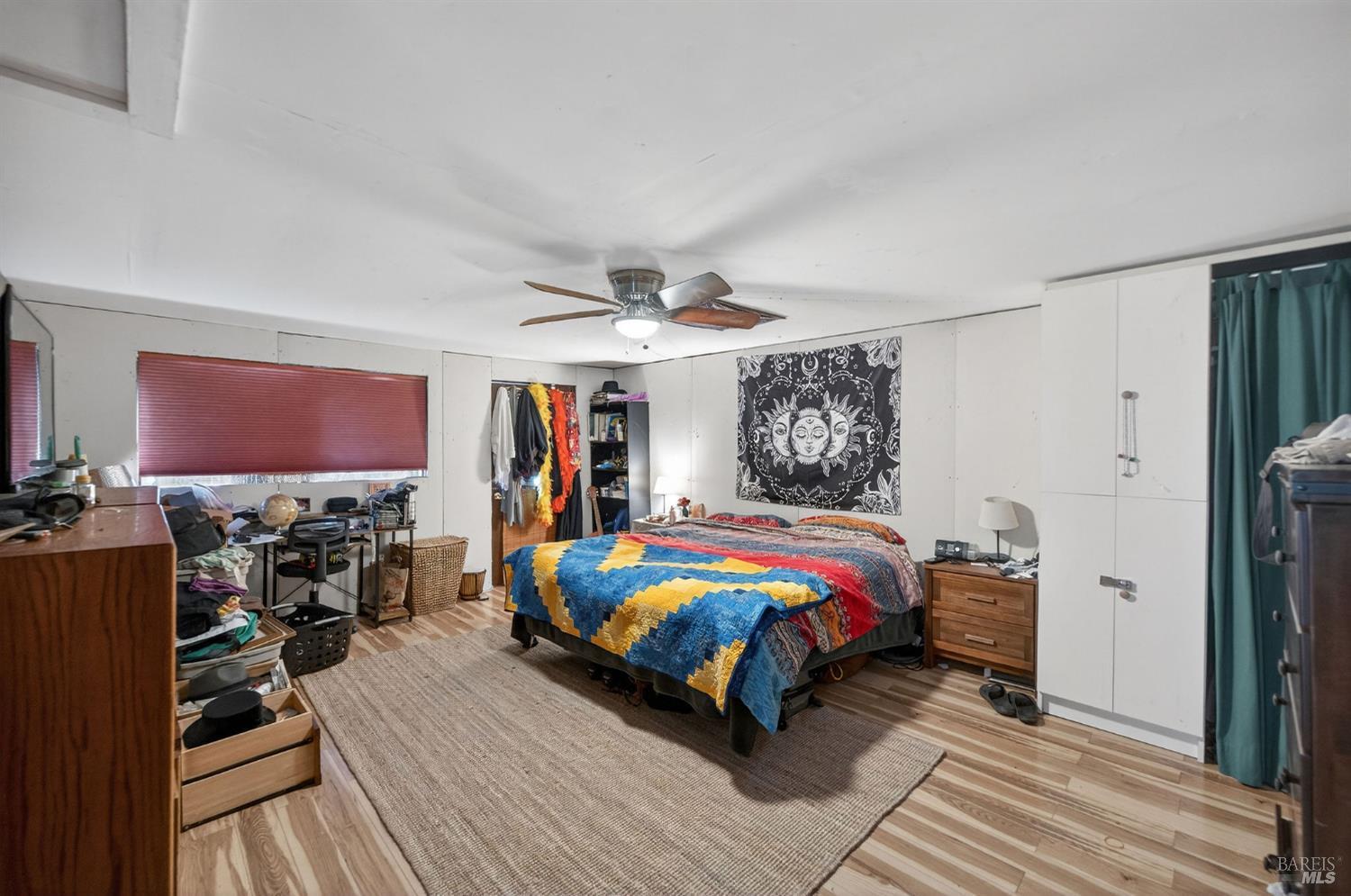 1450 Timberhill Road Santa Rosa, CA 95401 - Photo 38 of 50 a bedroom with a bed and a flat tv screen