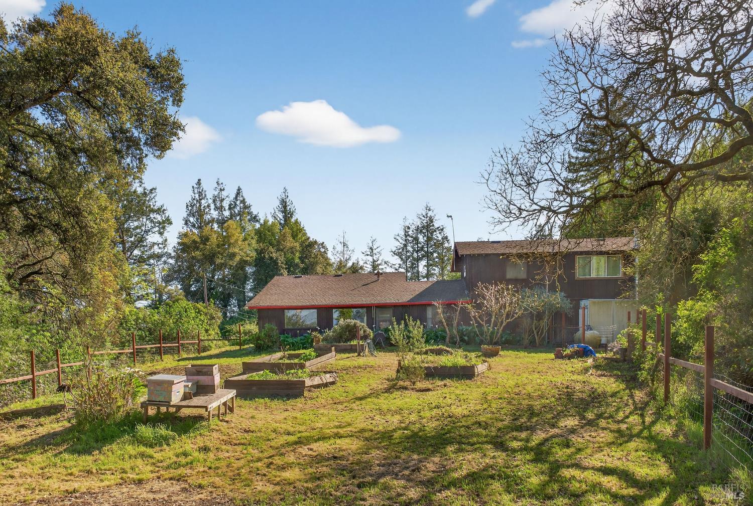 1450 Timberhill Road Santa Rosa, CA 95401 - Photo 44 of 50 a view of a swimming pool with a table and chairs under an umbrella