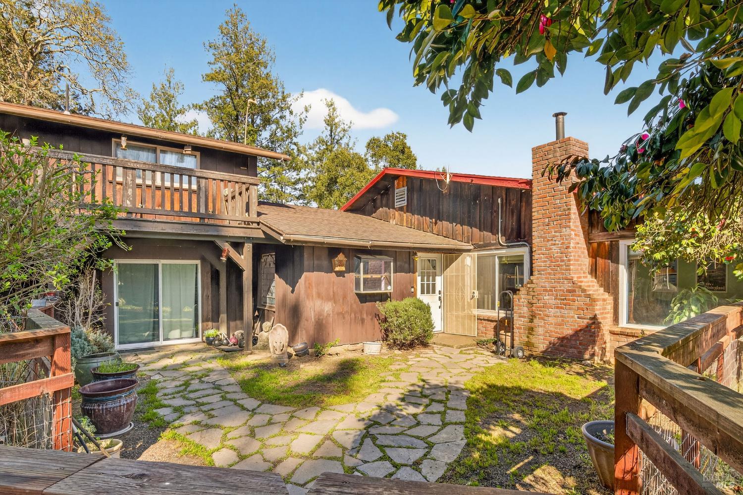 1450 Timberhill Road Santa Rosa, CA 95401 - Photo 46 of 50 a front view of a house with a yard