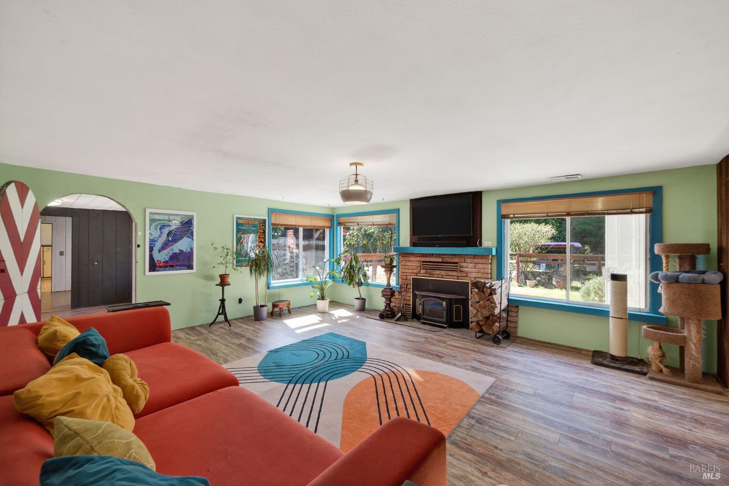 1450 Timberhill Road Santa Rosa, CA 95401 - Photo 7 of 50 a living room with furniture flat screen tv and a fireplace