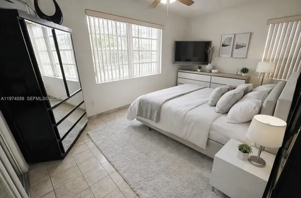 a bathroom with a sink a toilet and a shower