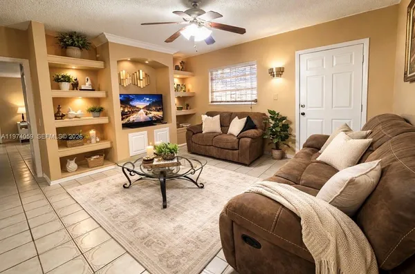 a living room with furniture and a flat screen tv