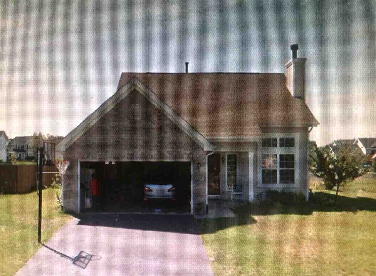 752 Bayfield Road Rockton, IL 61072 - Photo 1 of 1 a front view of a house with a yard and a garage
