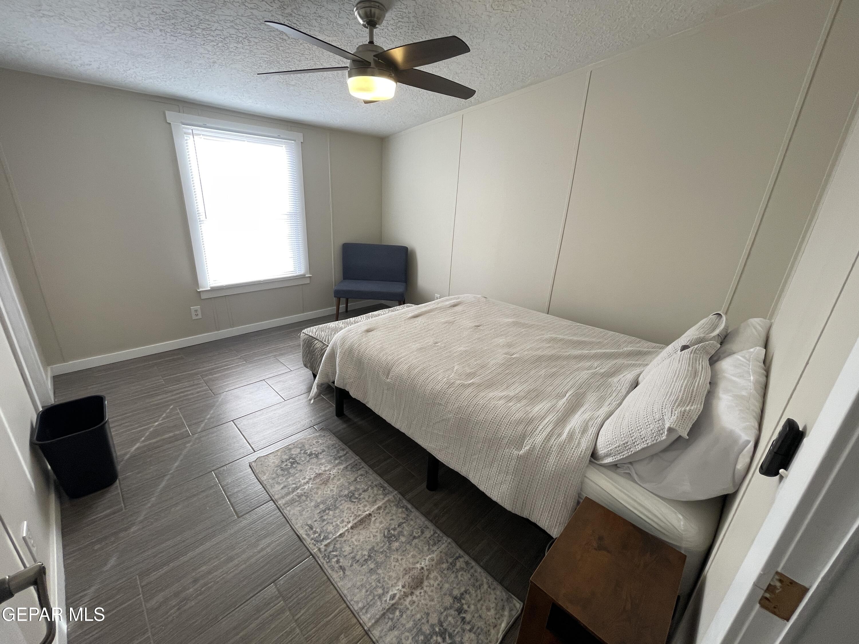 2901 Cook Street Truth Or Consequences, NM 87901 - Photo 17 of 28 a bedroom with a bed and a ceiling fan