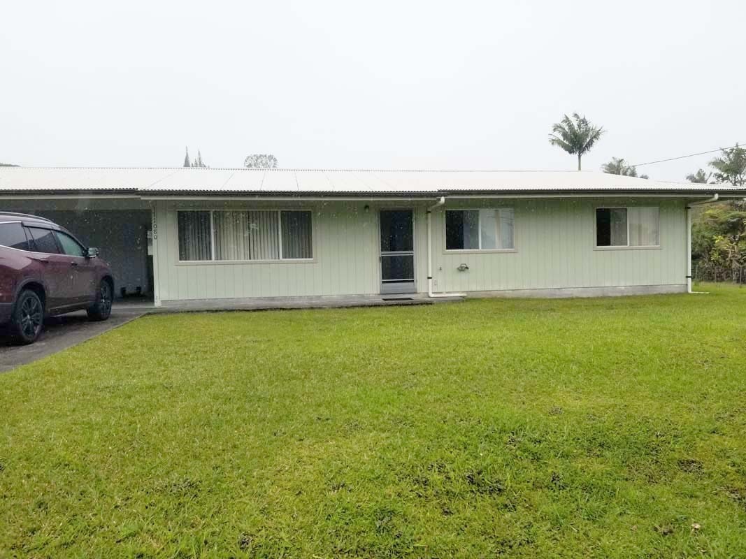 17-1080 Old Volcano Road Mountain View, HI 96771 - Photo 2 of 29 a front view of a house with yard