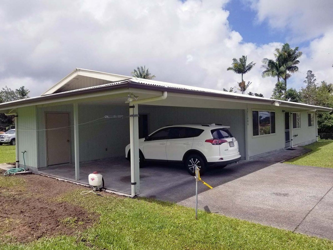 17-1080 Old Volcano Road Mountain View, HI 96771 - Photo 4 of 29 a front view of a house with garden