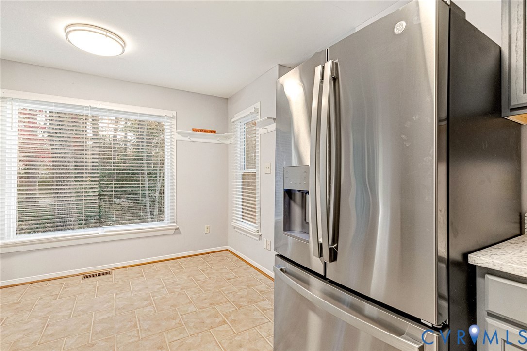 8703 Ewes Court Chesterfield, VA 23236 - Photo 14 of 31 a view of an empty room with window and refrigerator