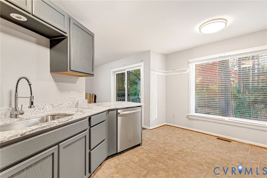 8703 Ewes Court Chesterfield, VA 23236 - Photo 15 of 31 a kitchen with a sink stove and cabinets