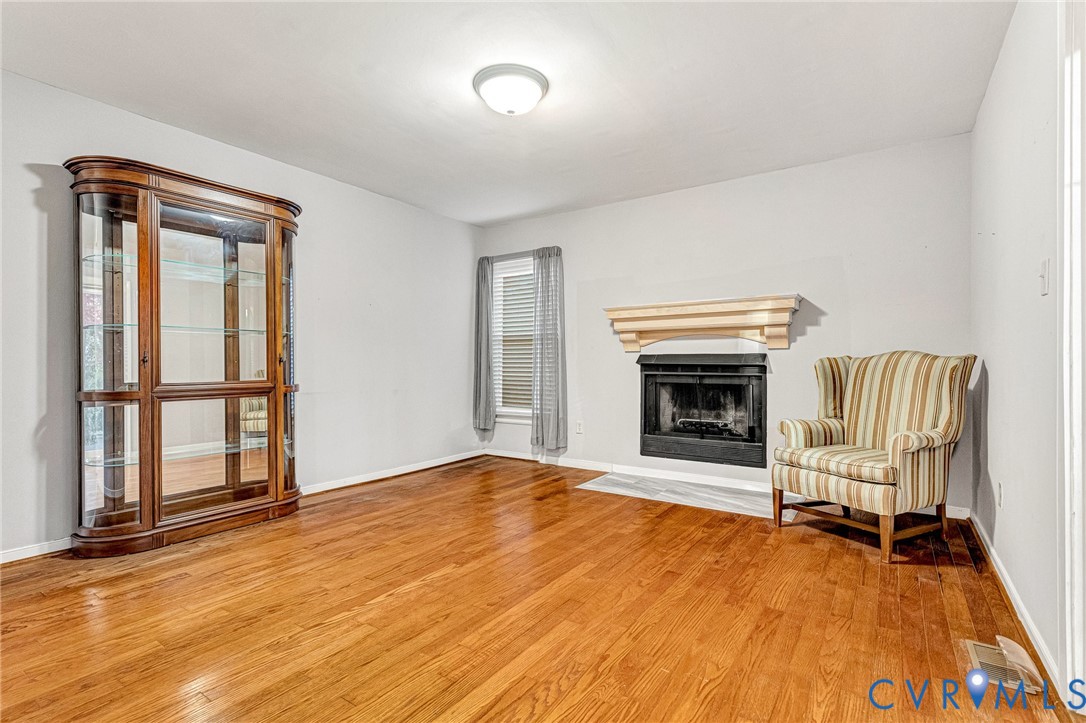 8703 Ewes Court Chesterfield, VA 23236 - Photo 21 of 31 a view of an empty room with a fireplace and a window