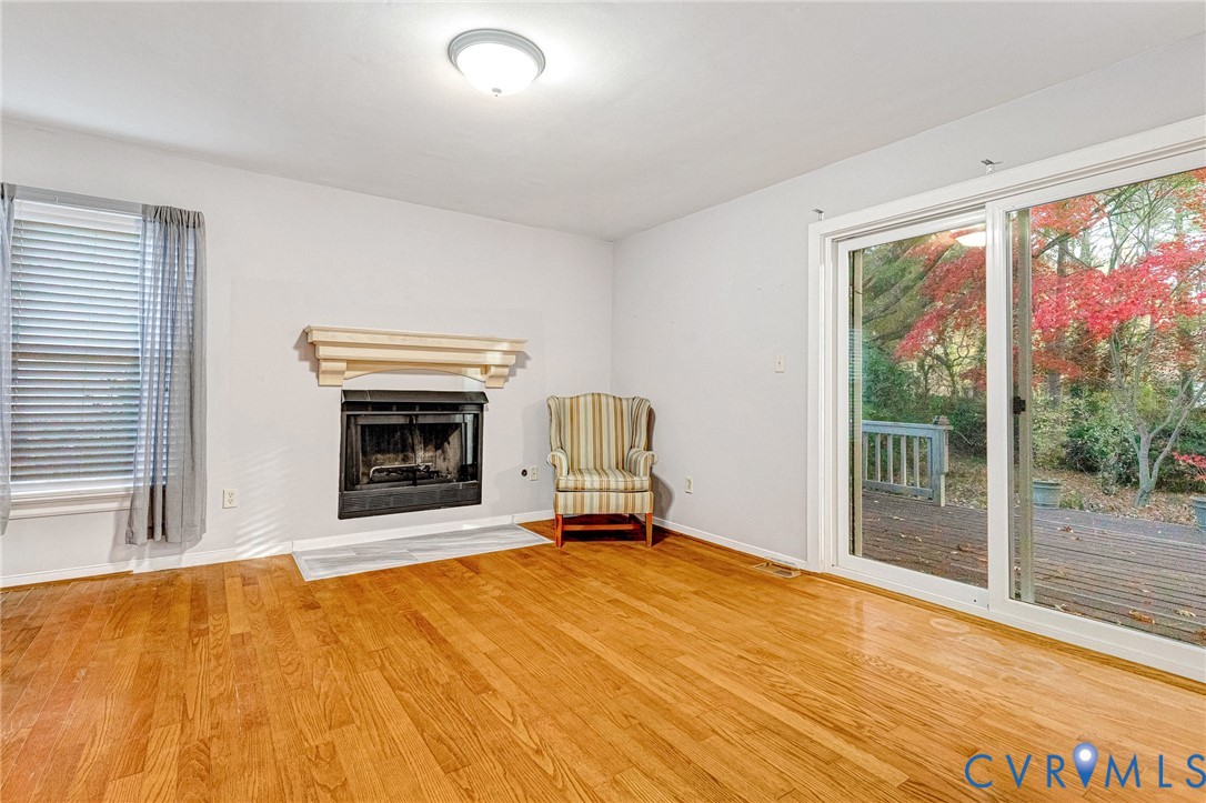 8703 Ewes Court Chesterfield, VA 23236 - Photo 22 of 31 a view of an empty room with a fireplace and a window