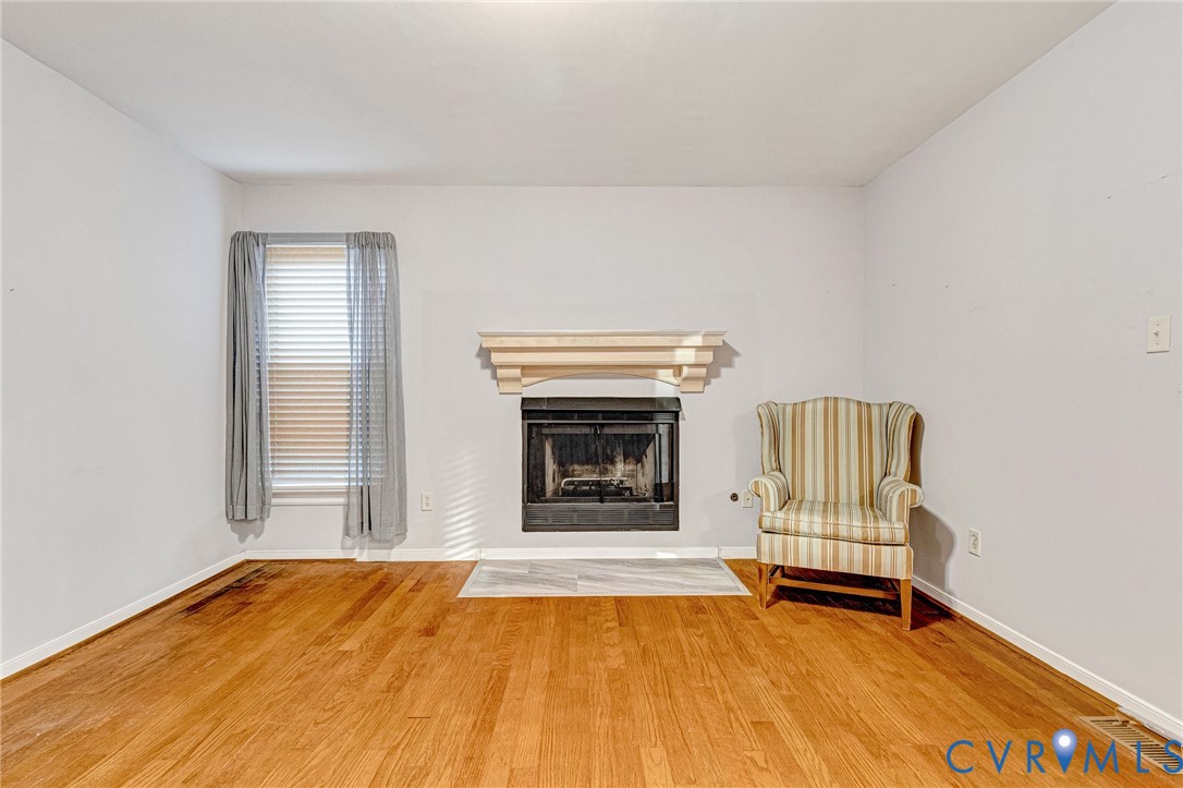 8703 Ewes Court Chesterfield, VA 23236 - Photo 25 of 31 a view of an empty room with a fireplace and a window
