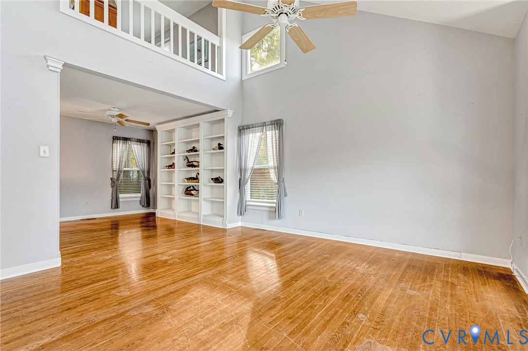8703 Ewes Court Chesterfield, VA 23236 - Photo 4 of 31 a view of an empty room with window and wooden floor