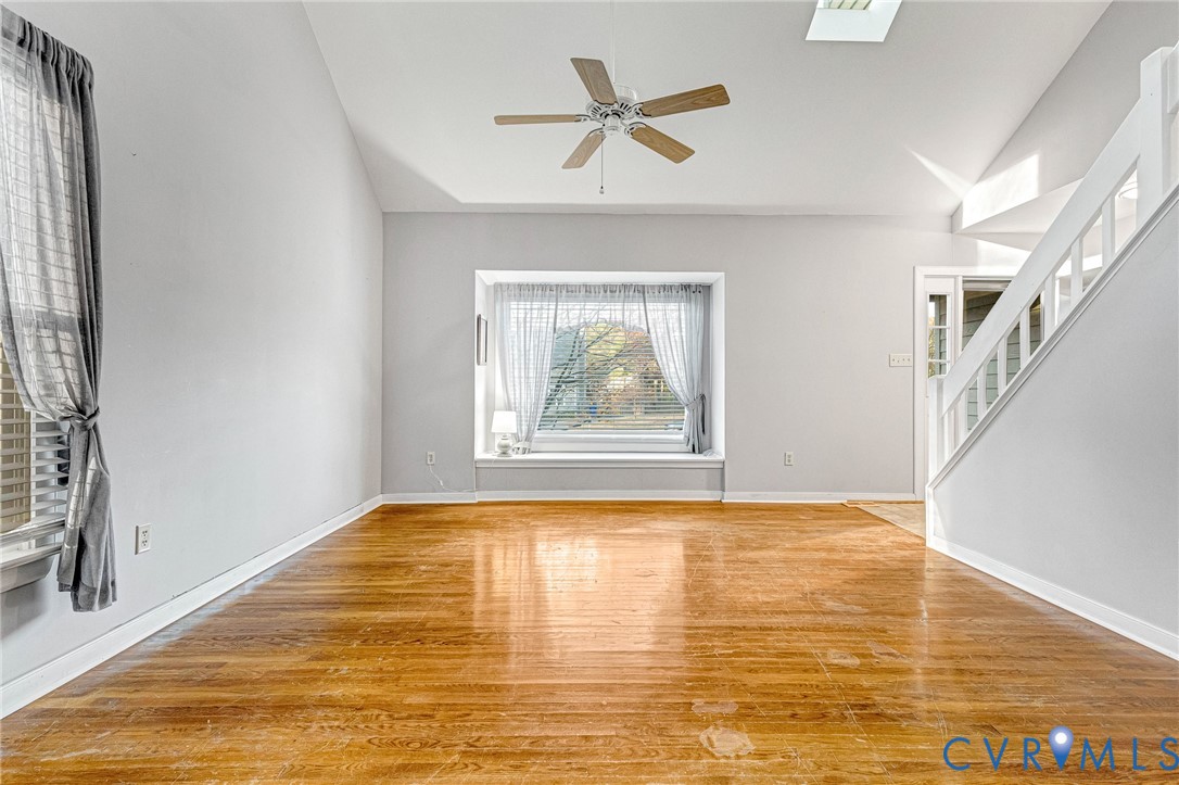 8703 Ewes Court Chesterfield, VA 23236 - Photo 6 of 31 a view of empty room with wooden floor and fan