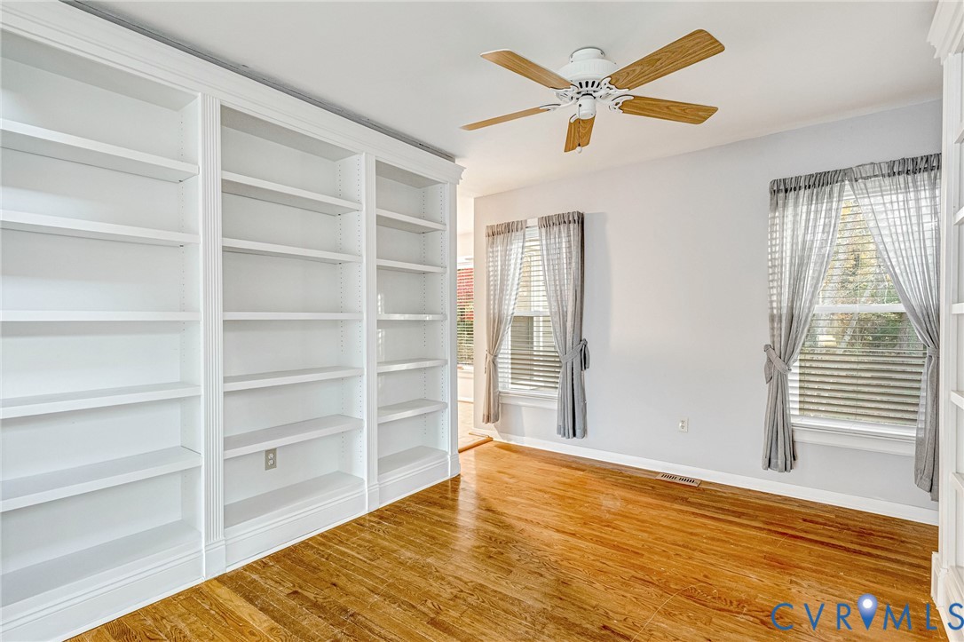 8703 Ewes Court Chesterfield, VA 23236 - Photo 8 of 31 a view of an empty room with a window and wooden floor