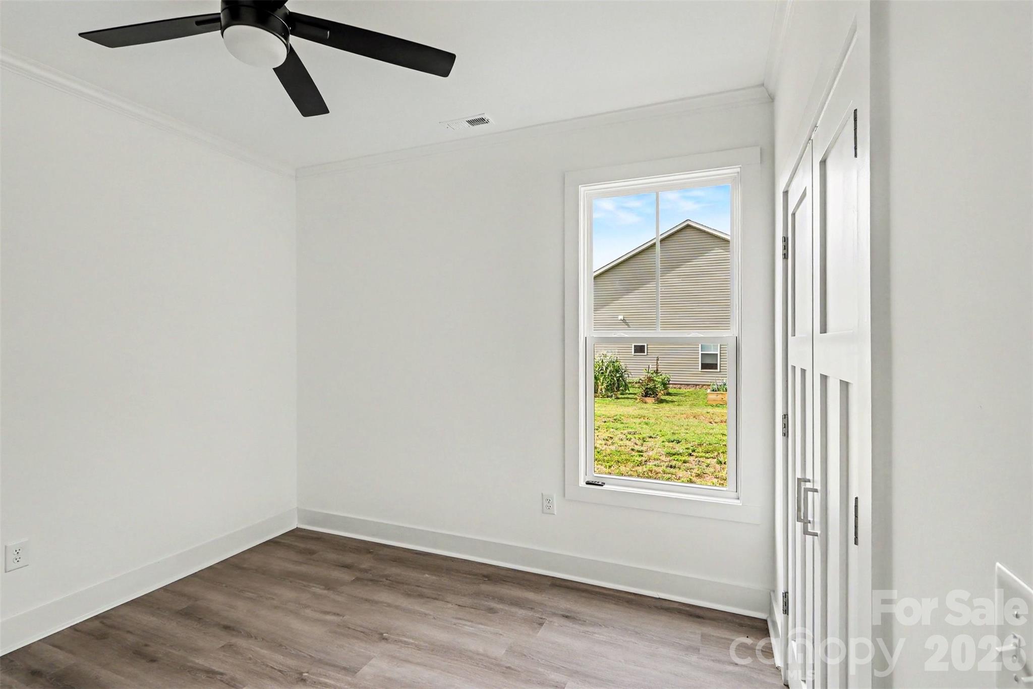 4115 Miller Road Salisbury, NC 28147 - Photo 19 of 26 a view of a hallway with wooden floor and a window