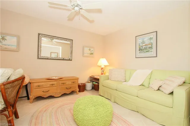 a bedroom with a bed and lamp