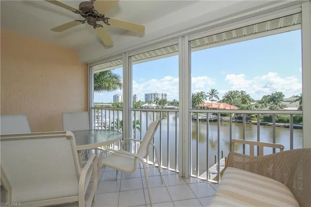 a view of a balcony with furniture