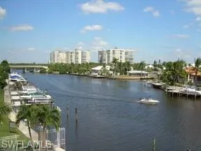a view of a city with tall buildings in ocean
